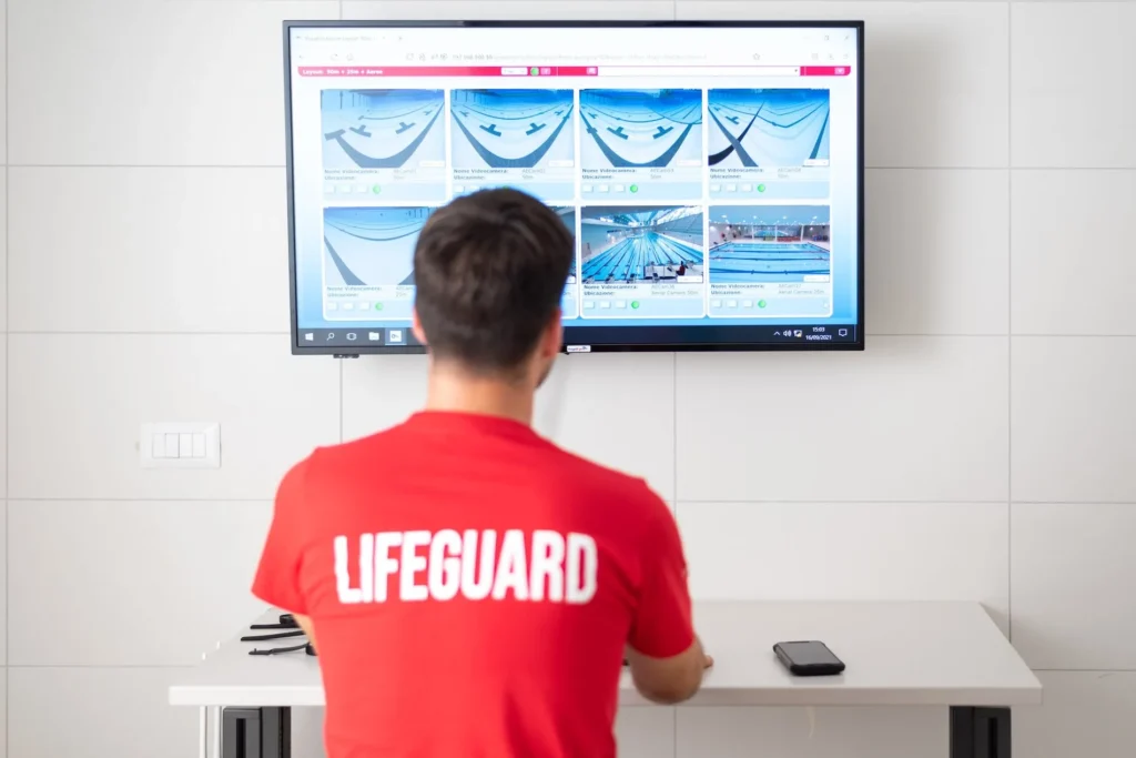 Lifeguard monitoring underwater camera images